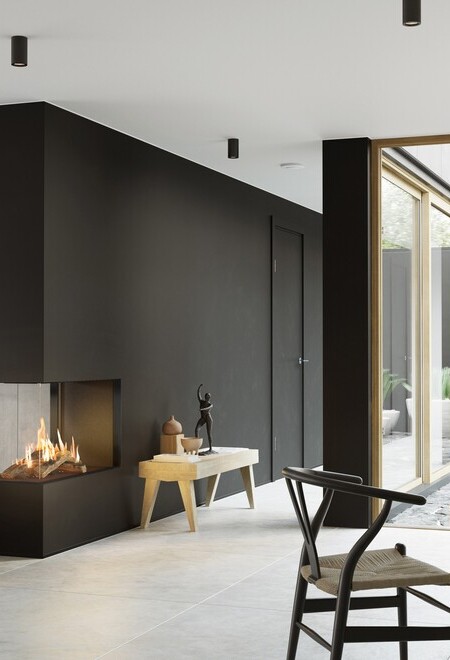 Gas-Kamin VISIO 90 RD passt als Raumteiler in einer schwarzen Wand ideal zwischen Wohnzimmer und Esszimmer und strukturiert den schlicht dekorierten Wohnraum
