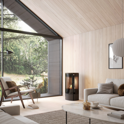 Bioethanol-Kaminofen CARO 90 BIO in Schwarz in einem hellen Wohnzimmer mit viel Holz