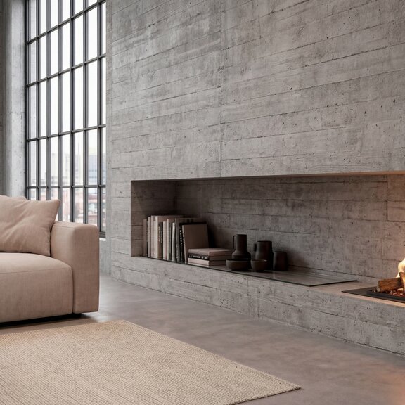 Bioethanol Feuerstelle Logicwood Linear im Wohnzimmer in Betonwand eingebaut mit beigem Sofa und Teppich